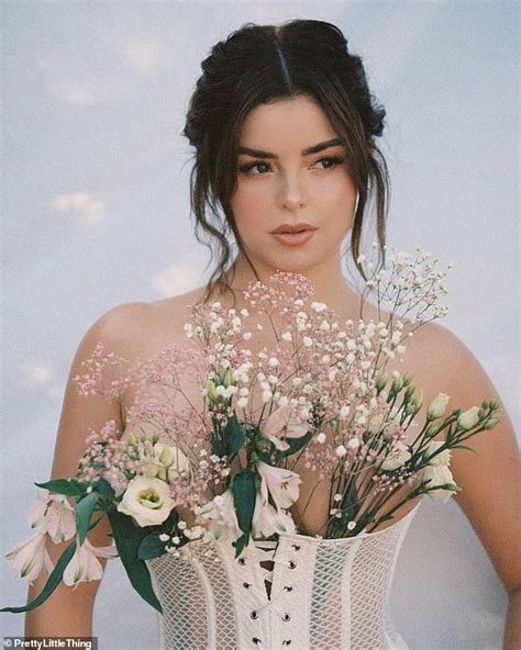 Demi Rose Stuns In A White Mesh Corset For Ibiza Photoshoot Embracing A Floral Theme