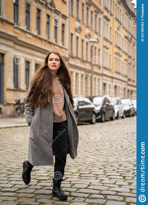 Young Brunette Woman Dressed Casually Walking On Street Road On Daytime