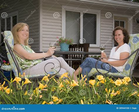 Women On Patio Framed By Flowers Stock Photo Image Of Celebration Home