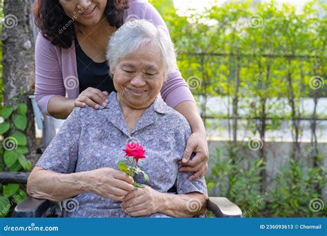 Caregiver Daughter Hug And Help Asian Senior Or Elderly Old Lady Woman