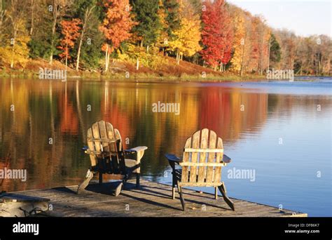 Adirondack Chairs In A Dock In Autumn Starlight Pennsylvania Usa