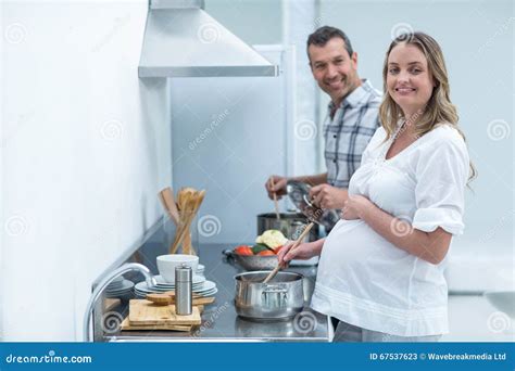 Pregnant Couple In Kitchen Stock Image Image Of Expecting 67537623