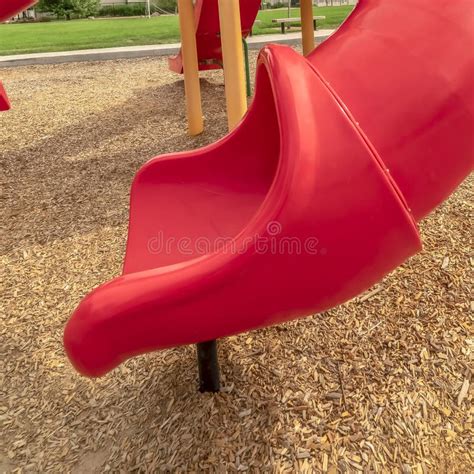 Square Frame Focus On The Colorful Playground Equipment At A Park With