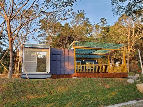 L Shaped Container House With Amazing Veranda Living In A Container