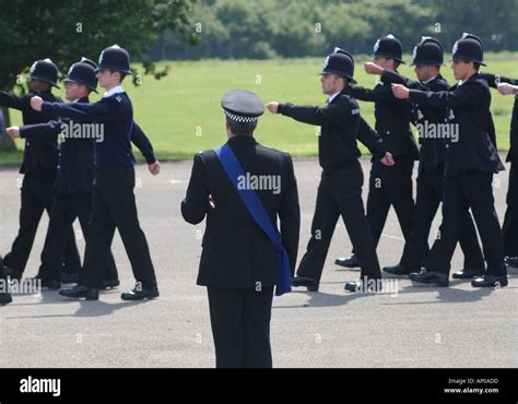 newly trained police officers marching on their passing out parade ashford police training