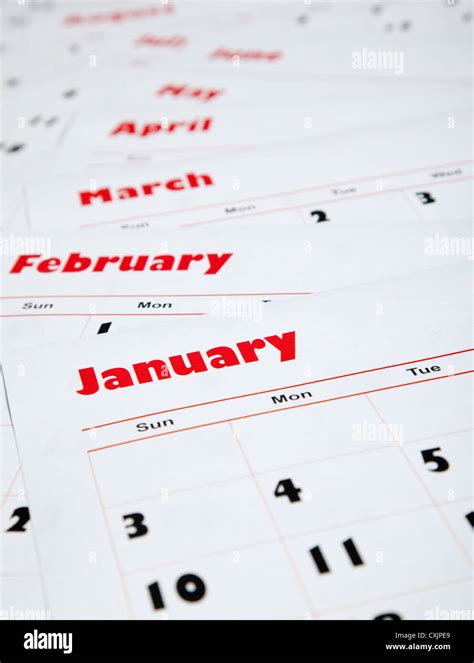 Stack Of Monthly Calendars In Red Ink Stock Photo Alamy