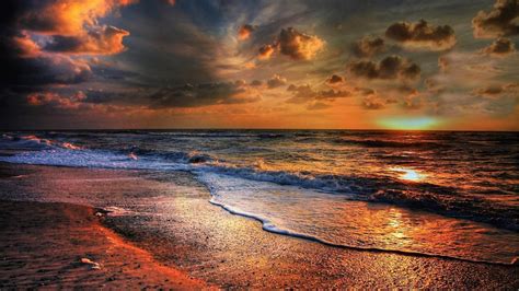 Ocean Waves Under White Black Clouds Sky During Sunset Reflection On