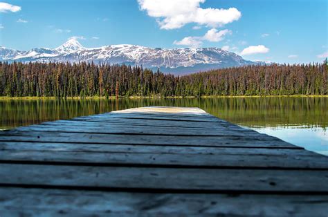 Dock On A Lake With Mountains In The Background Digital Art By Randy