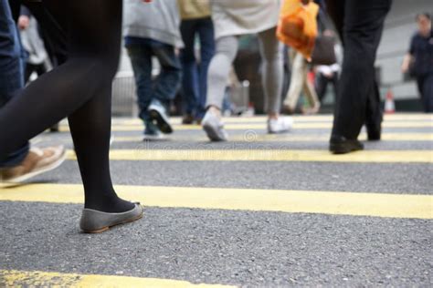 Close Up Of Commuters Feet Crossing Busy Street Royalty Free Stock