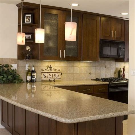 Light brown wood floor with a white farmhouse sink, shaker cabinets, black granite countertops, beige black mixed cement 6″x6″ backsplash, an island and black countertops. Pin by Amber Akers on Kitchen in 2020 (With images ...