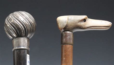 A Late Victorian Rhino Horn Handled Walking Cane The Handle Carved In