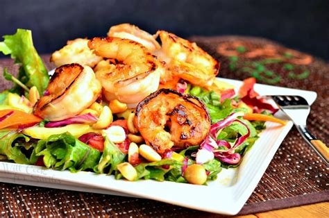 Thai shrimp crunch salad made with a delicious and easy peanut sesame dressing and topped with crispy shrimp and crunchy almonds. Thai Shrimp Salad with Peanut Dressing - Will Cook For Smiles