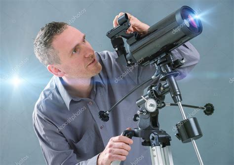 Man Looking Through Telescope Stock Photo By ©amaviael 42128571