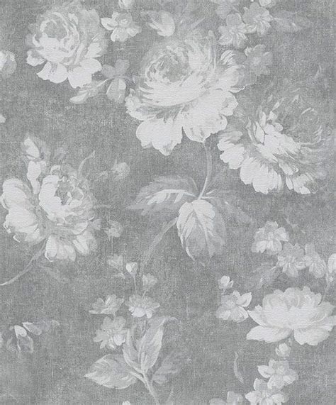 A Black And White Photo Of Flowers On A Wallpapered Surface With An Old
