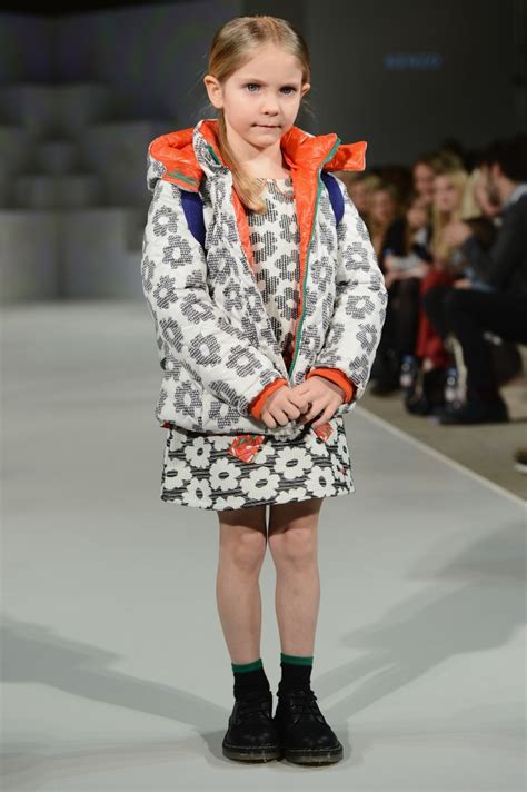 A Model Wearing Little Marc Jacobs Look 4 Autumnwinter 13 Walks The Runway At The Global Kids