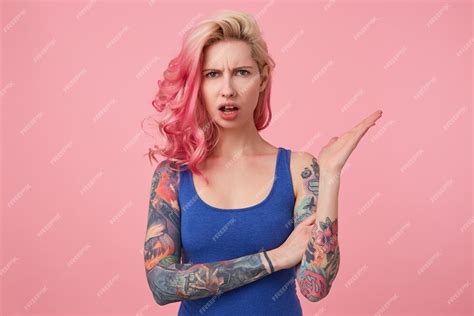 Free Photo Young Beautiful Outraged Pink Haired Woman In Blue T Shirt
