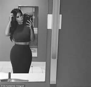Kim Kardashian Poses For A Photo In The Restroom As She Primps In The Mirror Daily Mail Online