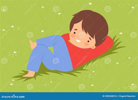 Cute Boy Lying Down On Green Lawn Kid Lying On Grass Dreamily Looking