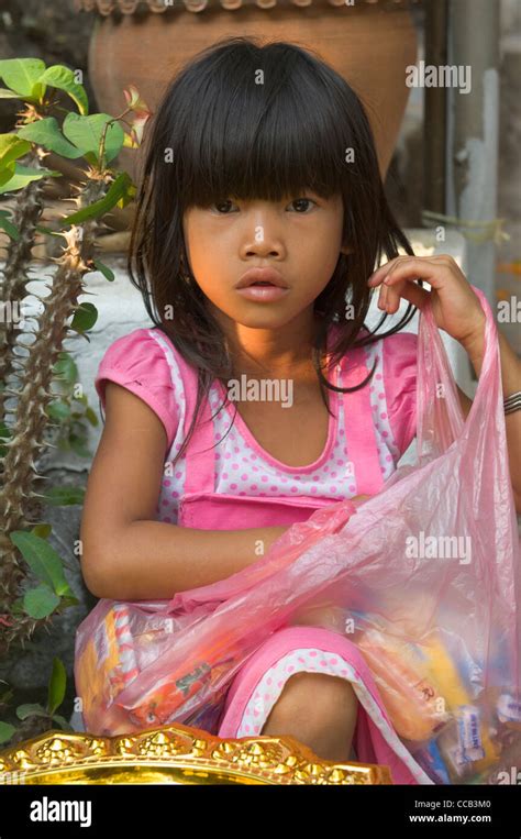 lao girl waiting for sweets on mount phousi on the first day of the new year lao new year pi