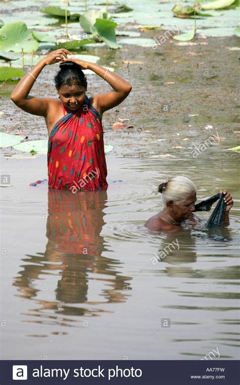 Download This Stock Image Women Bathing At Bolgarh Village Orissa India Aa77fw From Alamys