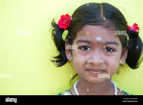 Pretty Happy Young Indian Village Girl Portrait With Roses In Her Hair