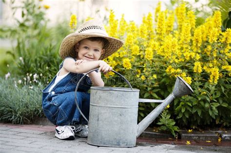 Little Boy With Watering Can In Summer Park Stock Image Image Of
