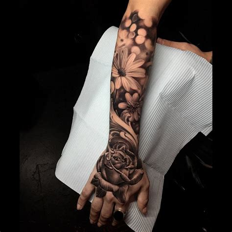Rose On Hand And A Daisy In This Girl S Floral Half Sleeve Piece Tattoo By Jose Contreras