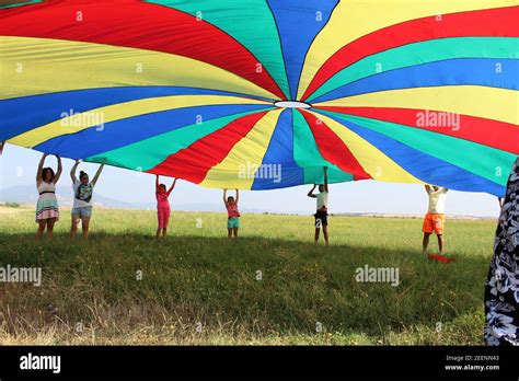 Children Playing Outdoors With Parachute In Bulgaria Stock Photo Alamy