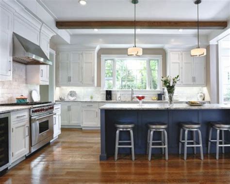 This example offers plenty of storage (cabinets rise to the ceiling). White Kitchen Navy Island 27 - DECORATHING