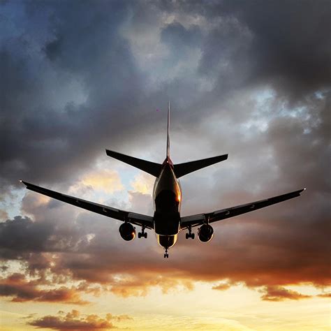 Plane Landing On Heathrow Runway 27r During Sunset Raviation