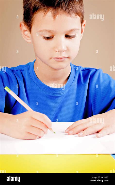 Little Boy Drawing With Colored Pencils Stock Photo Alamy