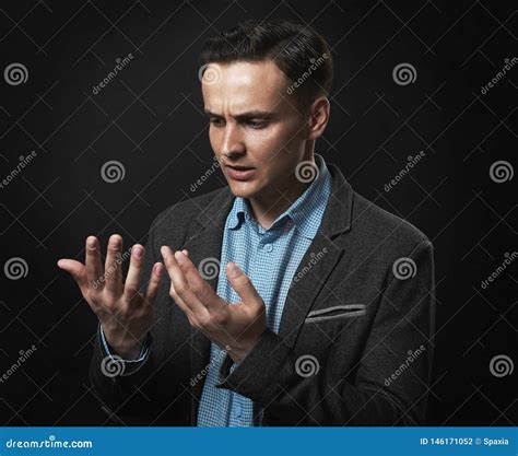 Thoughtful Handsome Man Is Looking At His Hands Stock Photo Image Of