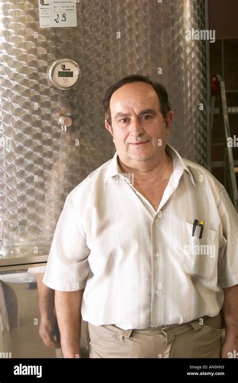 Enver Ulqini Oenologist And Winemaker In Front Of A Stainless Steel