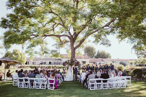 A Wedding Ceremony Under A Large Tree