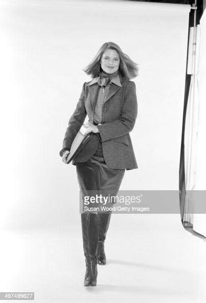 American Model Christie Brinkley Poses Dressed In Business Attire