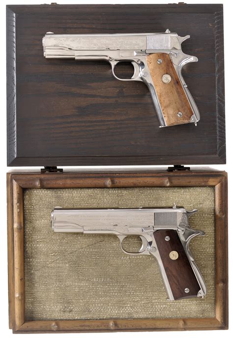 Two Cased Colt World War Ii Commemorative Semi Automatic Pistols Rock