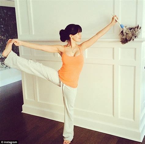 Hilaria Baldwin Dusts While Holding Rigid Yoga Pose And Then Stands On