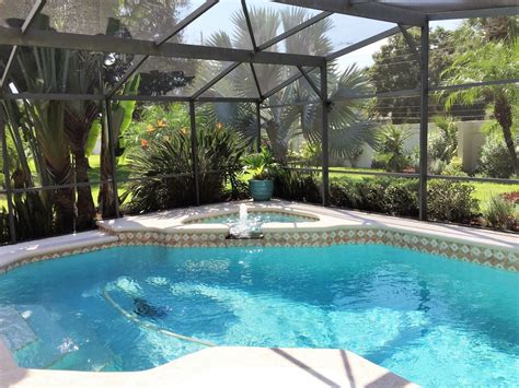 Tropical Swimming Pool With Pool With Hot Tub And Skylight Zillow Digs