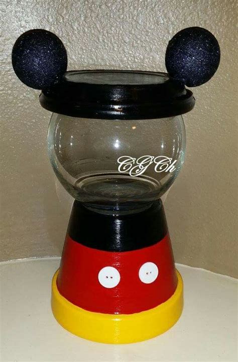 A Glass Bowl With Mickey Mouse Ears On Top