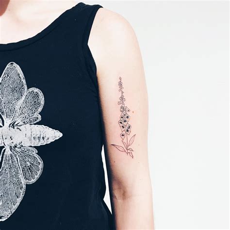 Delicate Foxglove Tattoo By Kelli Kikcio Inked On The Left Arm Framed Tattoo Beautiful Flower
