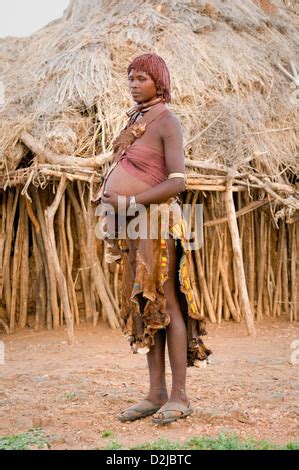 Portrait Of Hamar Pregnant Woman Standing In Front Of Hut Stock Photo Alamy