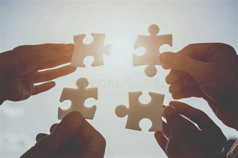 Businesspeople Holding Puzzle Stock Photo Image Of Cooperation