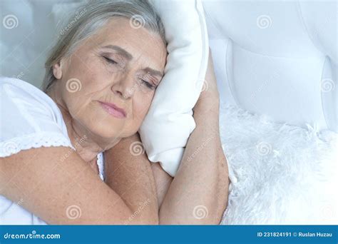 Portrait Of Thoughtful Senior Woman Lying On Bed Stock Image Image Of
