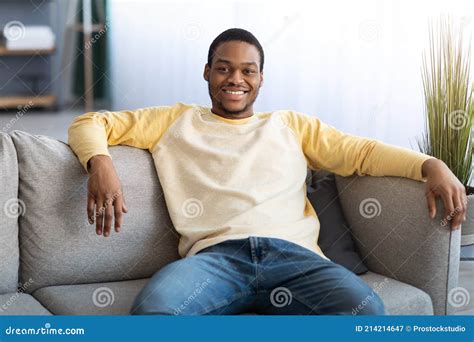 Handsome Black Man Sitting On Sofa At Home Stock Image Image Of