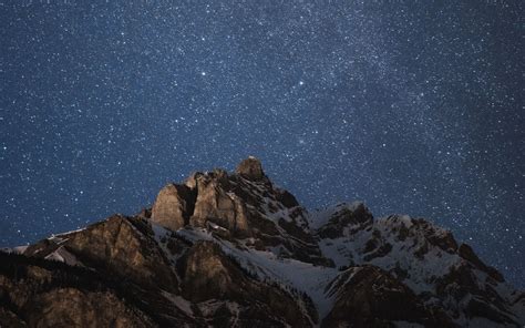 Download Wallpaper 1440x900 Mountain Peak Starry Sky Night Dark