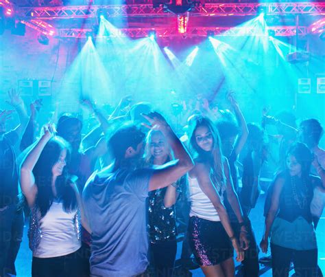 People Dancing On Dance Floor Of Nightclub Stock Photo