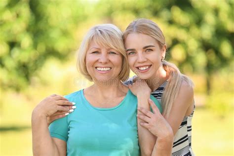 Portrait Of Beautiful Mature Woman With Her Daughter Outdoors Stock Image Image Of Mature