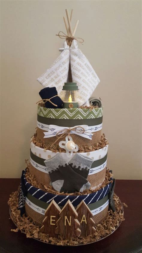 How to make a diaper cake for a baby shower or as a clever homemade gift for a new baby. Camping themed diaper cake! Camping baby shower ...