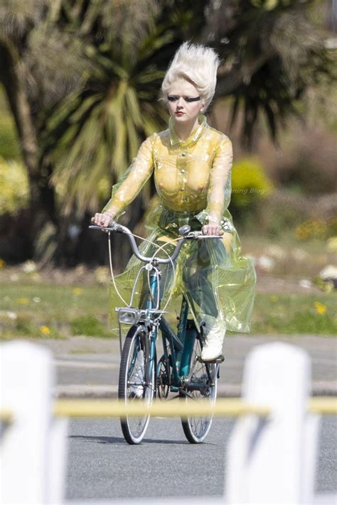 Maisie Williams Rides Bike In A See Through Plastic Coat 3