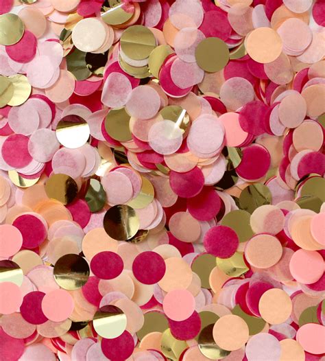 Many Pink And Gold Confetti Dots Are Scattered On Top Of Each Other